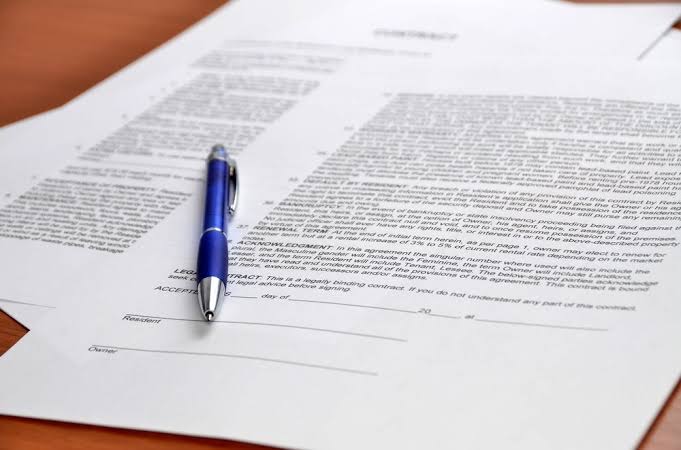 A debt settlement agreement document from a collection agency specifying pay for delete terms.